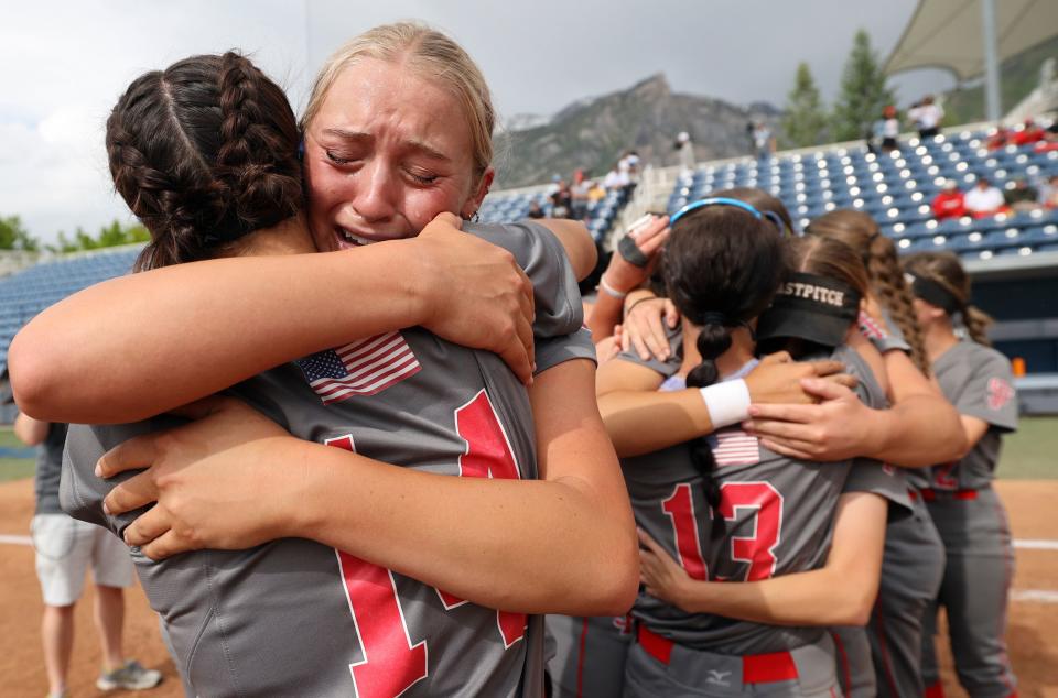 Spanish Fork’s Peyton Hall hugs Avery Sapp as they react to winning the 5A softball championship game against Bountiful at the Miller Park Complex in Provo on Friday, May 26, 2023. Spanish Fork won 8-4. | Kristin Murphy, Deseret News