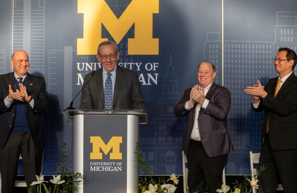 Geoff Chatas, Mayor Mike Duggan and University of Michigan President Santa Ono clap for Stephen Ross, the chairman and founder of Related Companies, as he speaks to community and media members during the groundbreaking event for the University of Michigan Center for Innovation in Detroit on Thursday, Dec. 14, 2023.