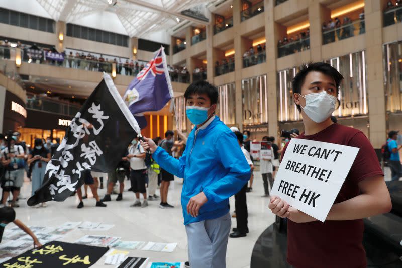 Pro-democracy demonstrators stage a rally at a shopping mall in Hong Kong