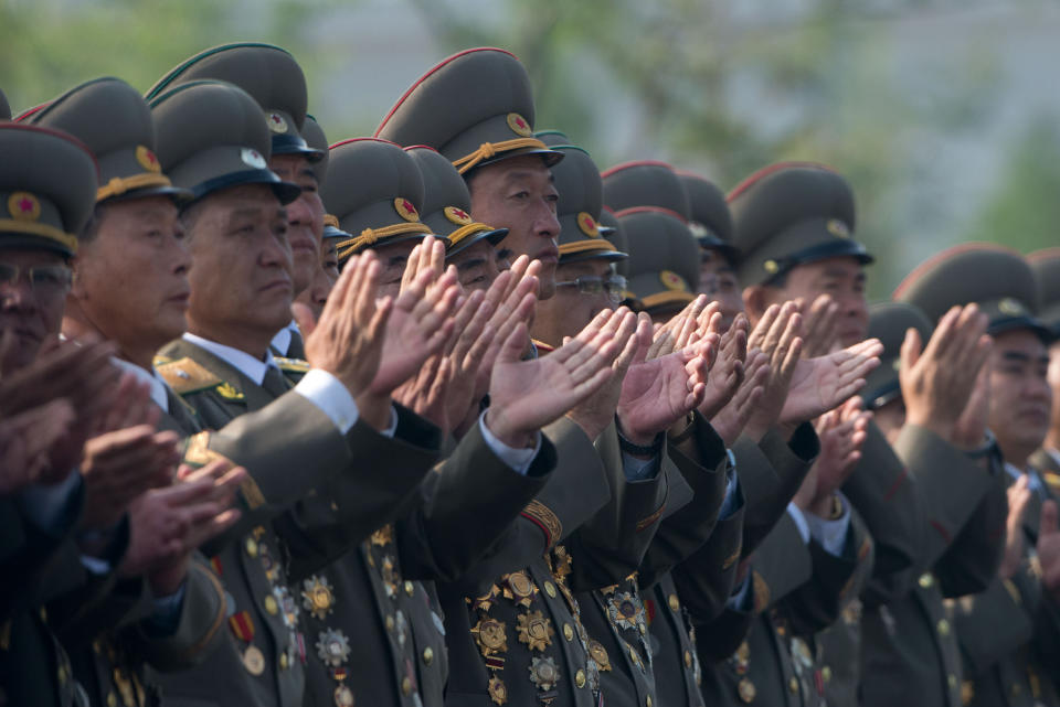 North Korean soldiers applaud during the arrival of the country's leader Kim Jong-Un at the inauguration of a Korean war military cemetery in Pyongyang on July 25, 2013. (Ed Jones/AFP/Getty Images)