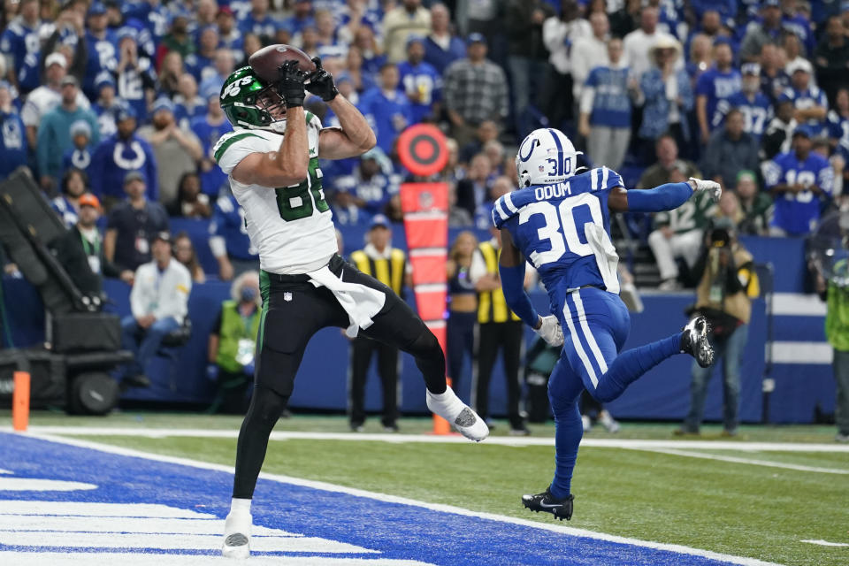 New York Jets' Keelan Cole (88) makes a touchdown reception against Indianapolis Colts' George Odum (30) during the second half of an NFL football game, Thursday, Nov. 4, 2021, in Indianapolis. (AP Photo/Michael Conroy)