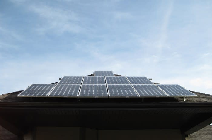 An array of solar panels on the roof of a home