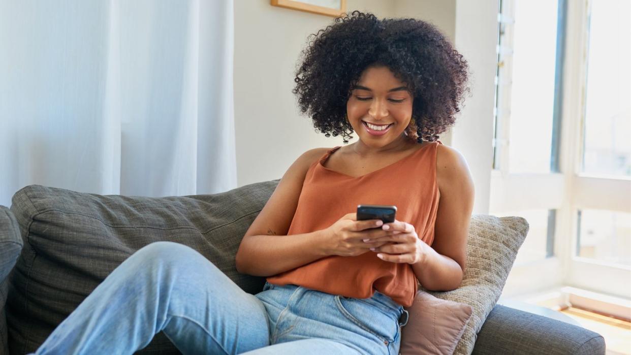 woman texting on cell phone