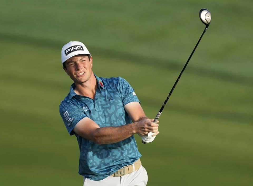 Viktor Hovland of Norway plays a shot on the 10th hole during the second round of the Dubai Desert Classic golf tournament in Dubai, United Arab Emirates, Friday, Jan. 28, 2022. (AP Photo/Kamran Jebreili)