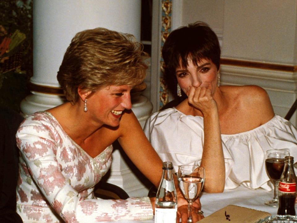 princess diana and liza minnelli laughing together at an event