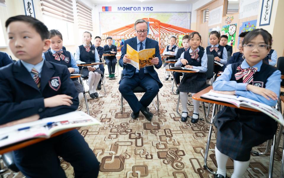 Foreign Secretary Lord David Cameron meets pupils and takes part in an English lesson at School No.23 in Ulaanbaatar, Mongolia