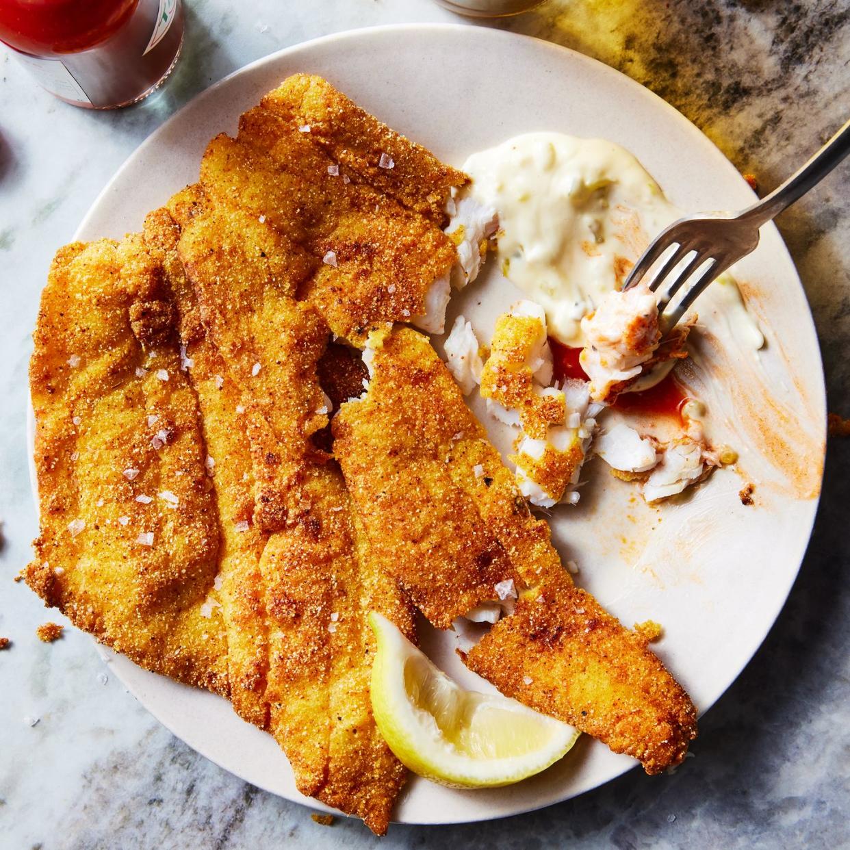 thin white fish coated in a seasoned cornmeal and flour blend, then shallow fried until golden brown and beautiful