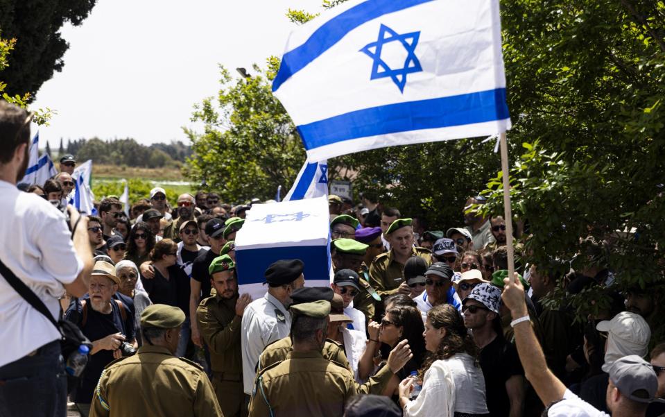 Soldiers carry the coffin of IDF soldier Dor Zimel. who died after being hit in a Hezbollah drone attack in Arab al-Aramshe on Thursday