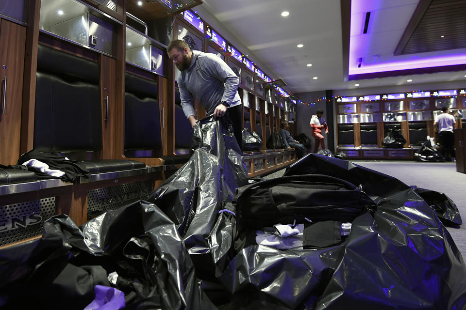 Baltimore Ravens guard James Hurst fills bags with items from his locker, Sunday, Jan. 12, 2020 in Owings Mills, MD. (AP Photo/Gail Burton)