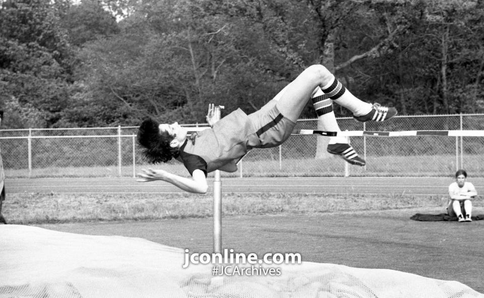 Harrison High's Cathy Eastridge use the "Fosbury Flop" technique to high jump during the girls' IHSAA regional track and field contests at Harrison. Cathy, first last year, finished third this time, with Jean Baltz of Merrillville taking first place. Harrison, the defending state champion, repeated as regional winner. The up-side-down, backwards jumping technique was introduced to the world by gold medalist Richard Fosbury during the 1968 Olympics. Photo taken May 21, 1985.