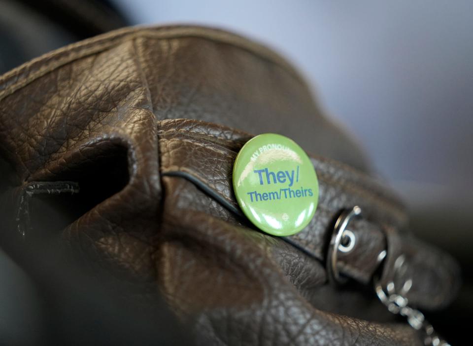 June 24, 2022; Columbus, Ohio, United States; A button on a bag carried by Natasha-Vincent Gay promotes their preferred pronouns, they/them/theirs.  Mandatory Credit: Barbara J. Perenic/Columbus Dispatch