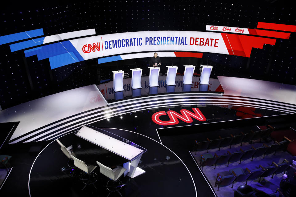 Workers prepare for a Democratic presidential primary debate hosted by CNN and the Des Moines Register, Tuesday, Jan. 14, 2020, in Des Moines, Iowa. (AP Photo/Patrick Semansky)