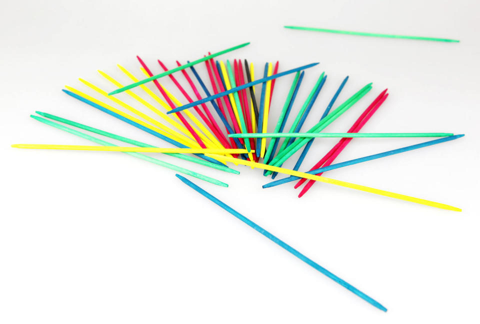 Mikado pick-up sticks game isolated on white background (Nenov / Getty Images)