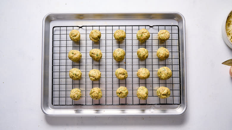 cooked meatballs on baking sheet