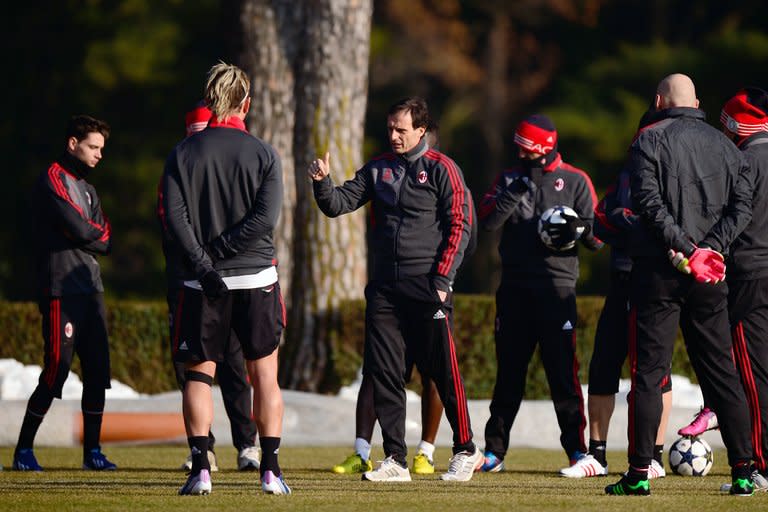 AC Milan coach Massimiliano Allegri talks to his players during a training session on February 19, 2013. After their worst ever start to a league campaign the Rossoneri have climbed to third place and within touch of securing one of the three Champions League places for next year