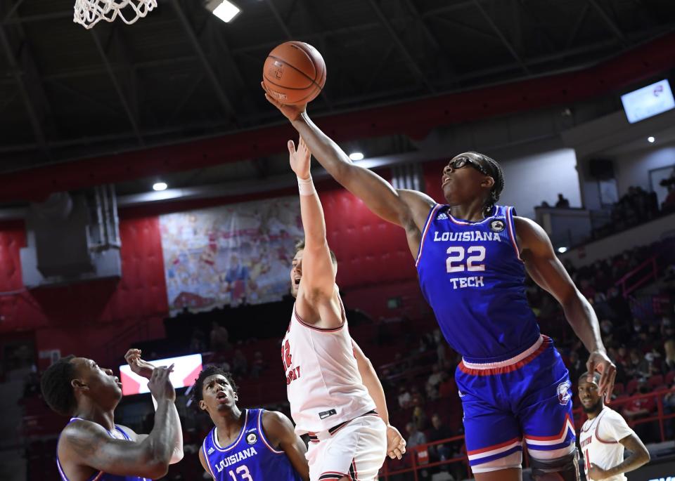 Louisiana Tech sophomore Isaiah Crawford (22) reaches for a rebound earlier this season.