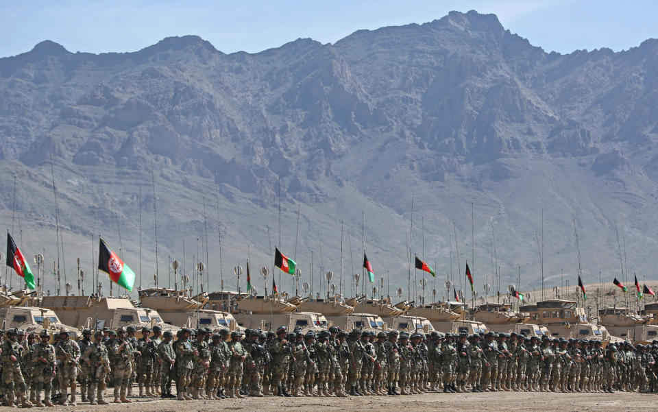 Afghan National Army (ANA) soldiers stand alert as they prepare to participate in a military exercise on the outskirts of Kabul, Afghanistan, Wednesday, April 30, 2014. The Afghan National Security Forces depend exclusively on billions of dollars in funding from the United States and its allies, money that is now at risk after President Hamid Karzai's refusal to sign a security agreement to keep a small U.S. force of trainers in the country after the NATO-led coalition ends its mission and withdraws at the end of the year. (AP Photo/Massoud Hossaini)