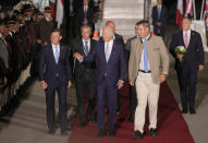 President Joe Biden, center, is accompanied by Bavarian Prime Minister Markus Soeder, second right, after arriving at Franz-Josef-Strauss Airport near Munich, Germany Saturday, June 25, 2022, ahead of the G7 summit. The G7 Summit will take place at Castle Elmau near Garmisch-Partenkirchen from June 26 through June 28, 2022. (AP Photo/Markus Schreiber)