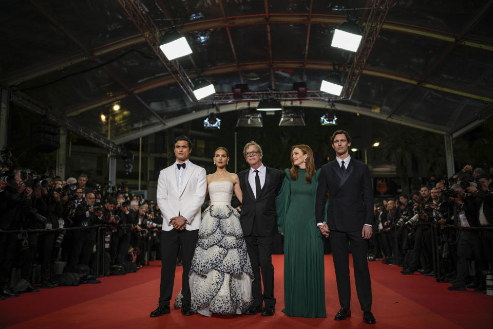 Charles Melton, from left, Natalie Portman, director Todd Haynes, Julianne Moore and Cory Michael Smith pose for photographers upon arrival for the premiere of the film 'May December' at the 76th international film festival, Cannes, southern France, Saturday, May 20, 2023. (AP Photo/Daniel Cole)