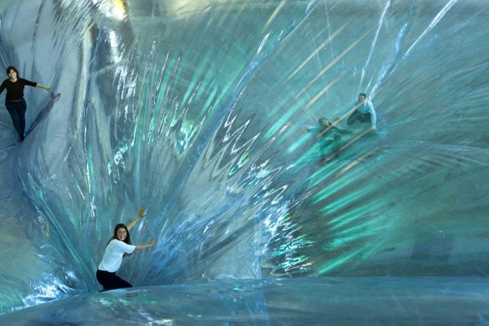 An art installation made adults feel like children again with a large suspended trampoline that gives the impression you're walking on air. The invention of Argentinian artist Tomas Saraceno, the trampoline hangs 65ft in the air in HangarBicocca, Milan, Italy and is for over 18s only (Caters)