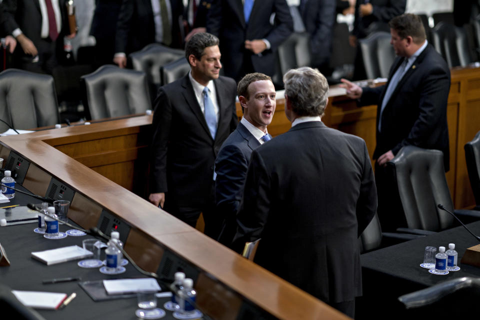 Zuckerberg and Kennedy shake hands and speak to each other following the hearing. (Photo: Bloomberg via Getty Images)