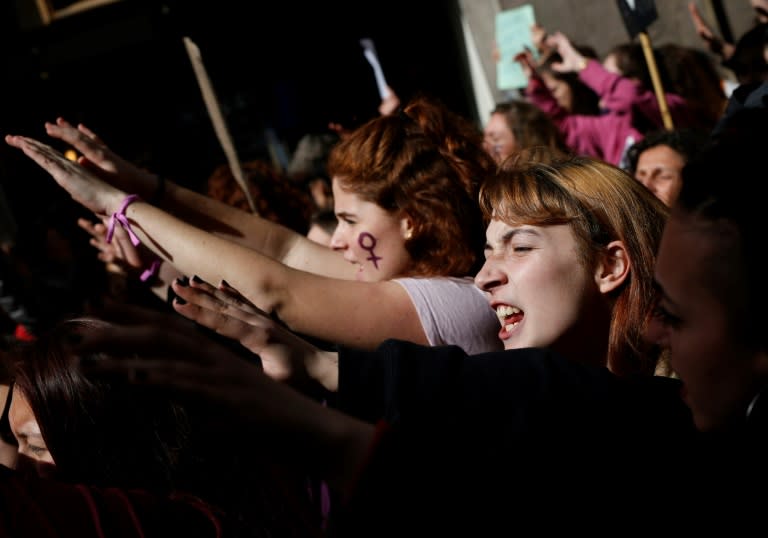 Demonstrators protest during a strike to defend women's rights on International Women's Day in Barcelona, on March 8, 2018