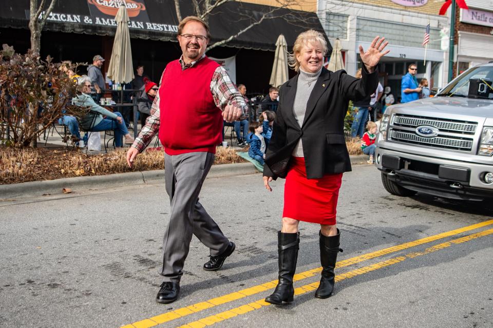 State Sen. Chuck Edwards and his wife, Teresa, walk in the Hendersonville Christmas parade on December 4, 2021.