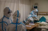 Medical workers treat patients infected with the coronavirus disease (COVID-19) at a hospital in New Delhi