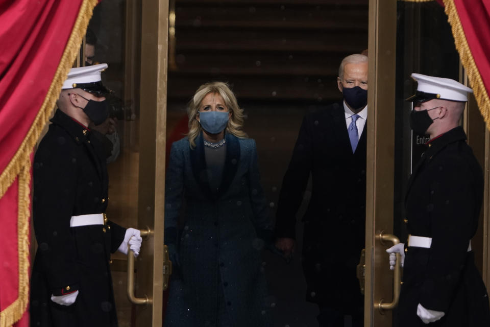 President-elect Joe Biden and his wife Jill, walk out for the 59th Presidential Inauguration at the U.S. Capitol in Washington, Wednesday, Jan. 20, 2021. (AP Photo/Patrick Semansky, Pool)