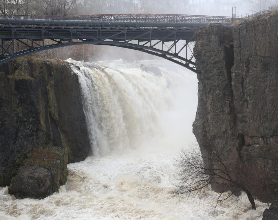 Paterson, NJ -- December 18, 2023 -- Water from the Passaic River rushes over the Great Falls in Paterson after the heavy rains from Sunday.