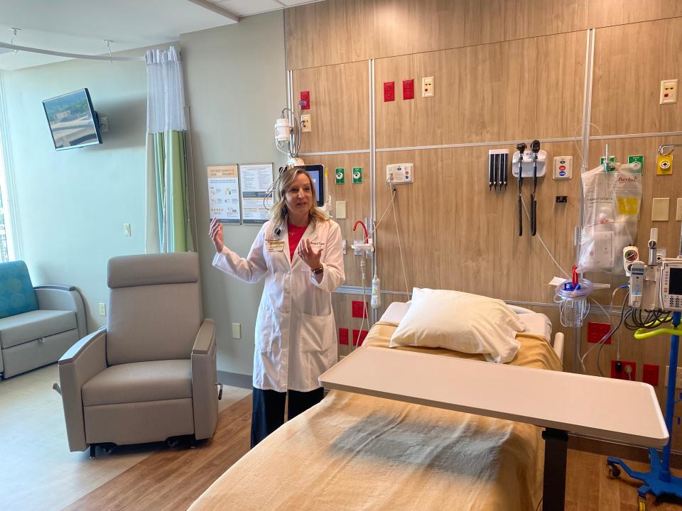 Laura Hesemann, chief medical officer and chair of pediatrics, on Tuesday shows off a room on the pediatrics floor of the new University of Missouri Children's Hospital.