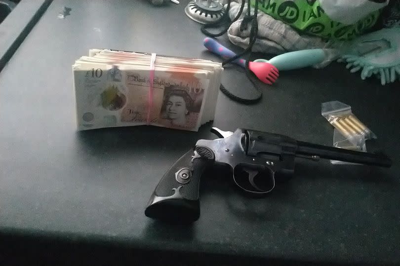 Police recovered this gun and cash from the crime scene