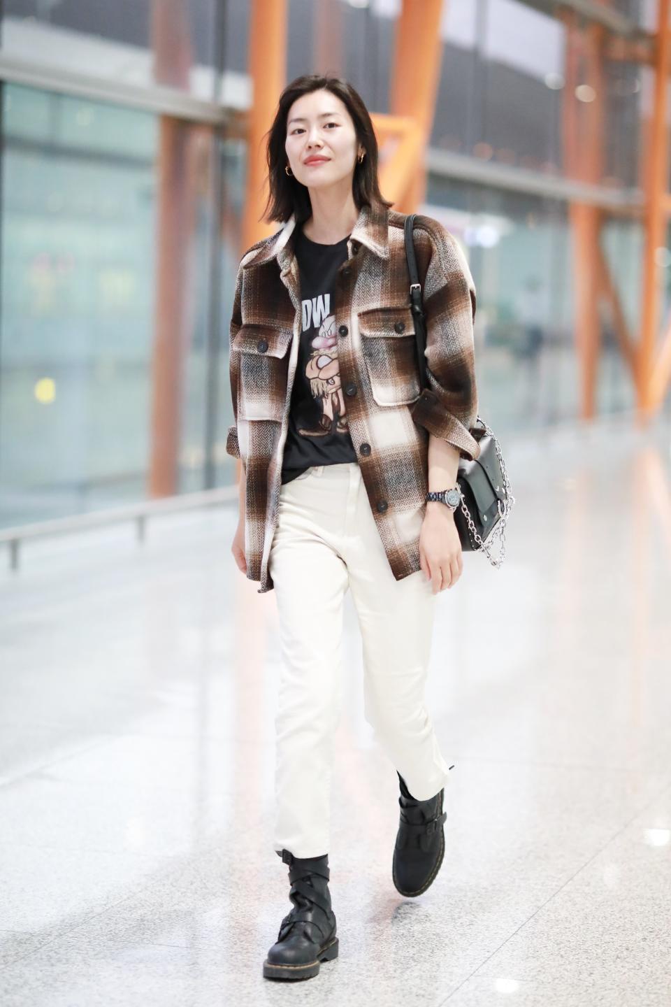 Model Liu Wen knows how to wear a flannel on and off the runway.