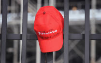 INDIANAPOLIS, IN - OCTOBER 17: A hat hangs on the gate at the Indianapolis Motor Speedway along with other tributes left by fans to two-time Indianapolis 500 winner Dan Wheldon on October 17, 2011 in Indianapolis, Indiana. Wheldon, winner of the 2011 Indy 500, was killed in a crash yesterday at the Izod IndyCar series season finale at Las Vegas Motor Speedway. (Photo by Scott Olson/Getty Images)