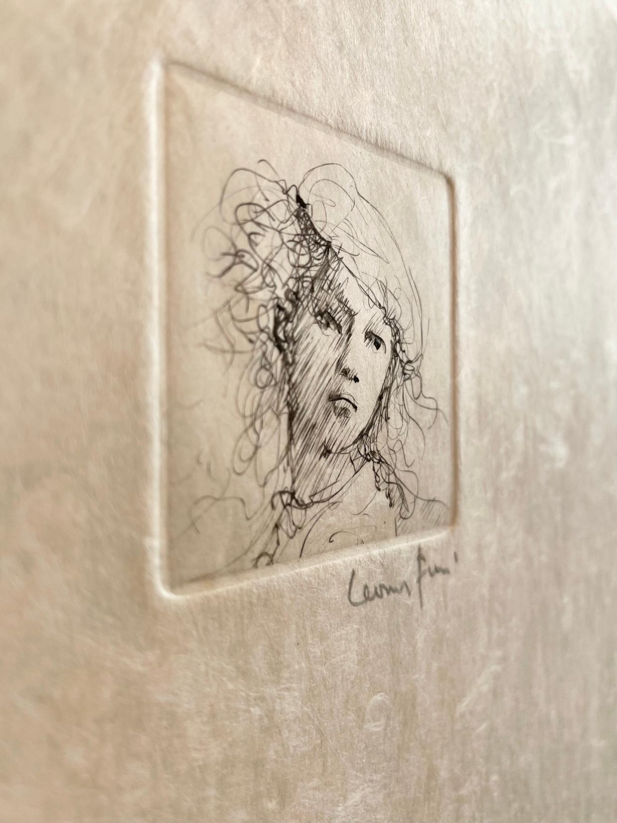 A close view of a Leonor Fini portrait that hangs on a wall full of her work in the current Sager Reeves Gallery Masters Exhibit.