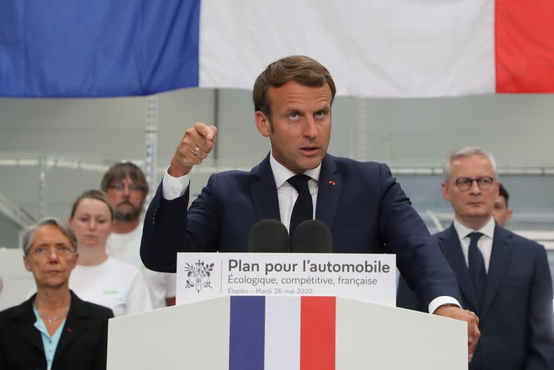 French President Emmanuel Macron visits a factory of manufacturer Valeo, in Etaples