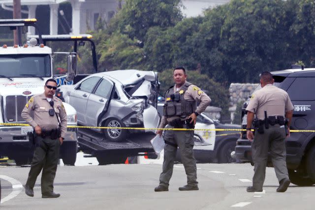 <p>Genaro Molina / Los Angeles Times via Getty</p> Sheriff deputies monitor the scene where four women were killed in a multi-vehicle crash in Malibu on October 18, 2023.