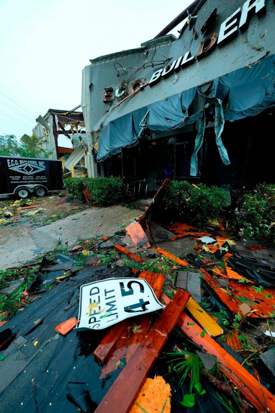 PHOTO: A street sign that wound up in the lobby of the heavily damaged building of E.C.O. Builders sits outside after what employees described as a tornado came through Slidell, LA, April 10, 2024.  (Gerald Herbert/AP)