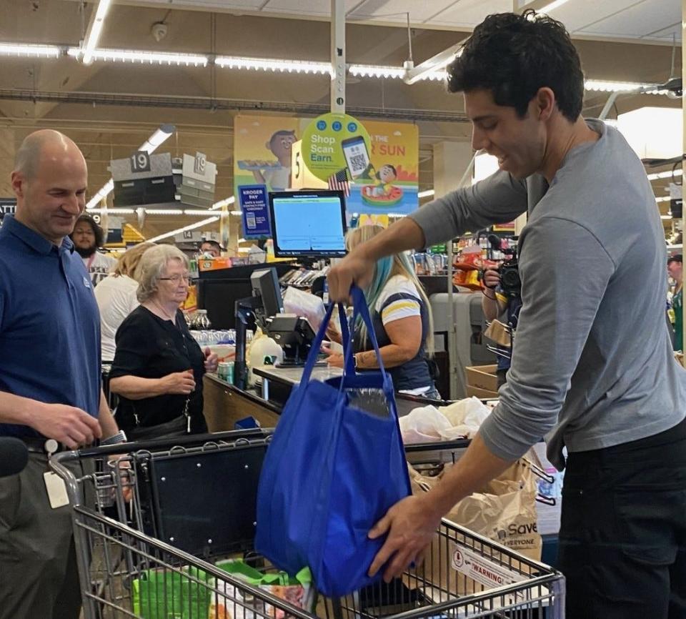 Christian Yelich paid for and bagged the groceries of Doug Meier, an Ixonia resident and lifelong Brewers fan, at Pick 'n Save, 2625 S. 108th Street, West Allis, on May 17, 2022. Yelich was participating in the Brewers organization's #KindnessInMKE annual event.