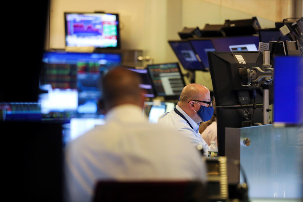 Traders work at the trading floor in the New York Stock Exchange in New York, the United States, Aug. 19, 2021. The S&P 500 Index closed at 4,405.80 points, up 5.53 points, or 0.13 percent. The Dow Jones Industrial Average closed at 34,894.12 points, down 66.57 points, or 0.19 percent.The Nasdaq Composite Index closed at 14,541.79 points, up 15.88 points, or 0.11 percent. (Photo by Wang Ying/Xinhua via Getty Images)
