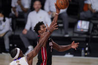 Miami Heat's Jimmy Butler (22) shoots the ball during the second half in Game 3 of basketball's NBA Finals against the Los Angeles Lakers, Sunday, Oct. 4, 2020, in Lake Buena Vista, Fla. (AP Photo/Mark J. Terrill)