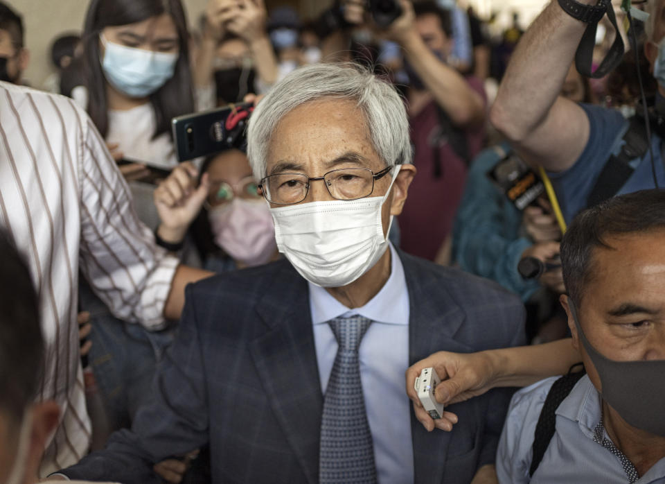 Pro-democracy activist Martin Lee walks out from a court after receiving a suspended sentence in Hong Kong Friday, April 16, 2021. A Hong Kong court on Friday sentenced five leading pro-democracy advocates, including media tycoon Jimmy Lai, to up to 18 months in prison for organizing a march during the 2019 anti-government protests that triggered an overwhelming crackdown from Beijing. A total of nine advocates were given jail terms, but four of them, including Lee, had their sentences suspended after their age and accomplishments were taken into consideration. (AP Photo/Vincent Yu)