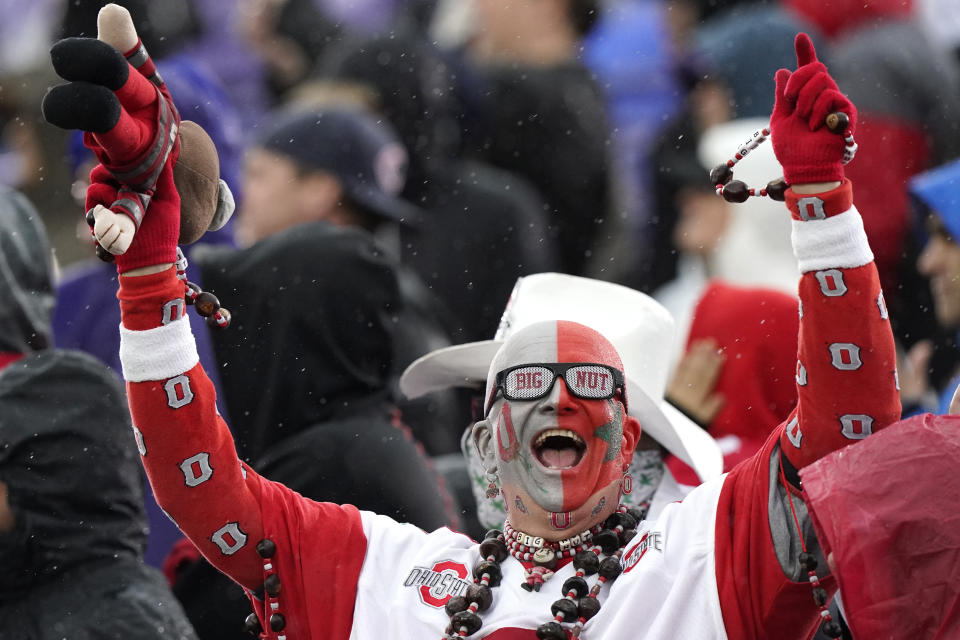 An Ohio State fan cheers for his team during the first half of an NCAA college football game against Northwestern, Saturday, Nov. 5, 2022, in Evanston, Ill. (AP Photo/Nam Y. Huh)