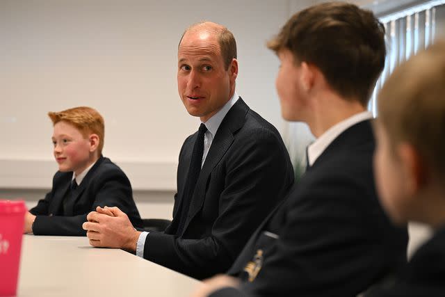 <p>Oli Scarff - WPA Pool/Getty Images</p> Freddie Hadley (left) with Prince William at St. Michael's Church of England High School on April 25, 2024