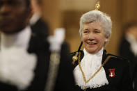 Lady Usher of Black Rod Sarah Clarke heads a procession through the Central Lobby to the Lords chamber during the State Opening of Parliament by Queen Elizabeth II, in the House of Lords at the Palace of Westminster in London, Thursday, Dec. 19, 2019. (Adrian Dennis/Pool Photo via AP)