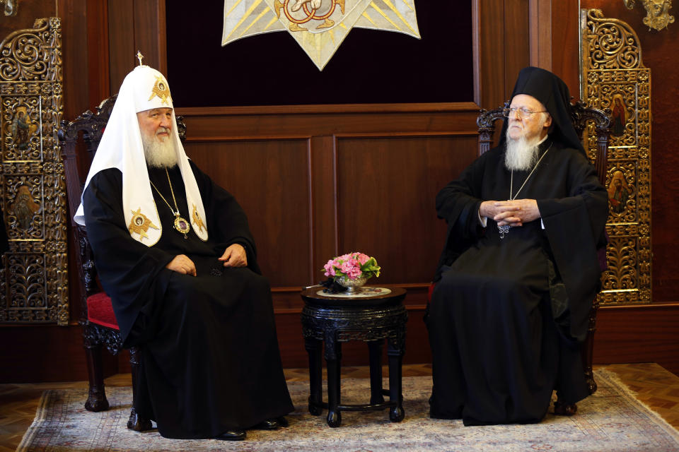 FILE - In this file photo taken on Friday, Aug. 31, 2018, Ecumenical Patriarch Bartholomew I, right, the spiritual leader of the world's Orthodox Christians, sits with Patriarch Kirill of Moscow, during their meeting at the Patriarchate in Istanbul. The Istanbul-based Ecumenical Patriarchate says it will move forward with its decision to grant Ukrainian clerics independence from the Russian Orthodox Church. The decision was announced Thursday, Oct. 11 following a regular holy synod meeting. (AP Photo/Lefteris Pitarakis, file)