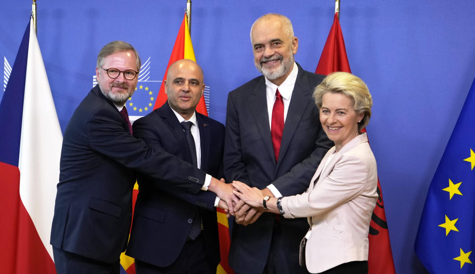 FILE - From right, European Commission President Ursula von der Leyen, Albanian Prime Minister Edi Rama, North Macedonia's Prime Minister Dimitar Kovacevski and Czech Republic's Prime Minister Petr Fiala shake hands prior to a meeting at EU headquarters in Brussels, on July 19, 2022. The war in Ukraine has put the European Union's expansion at the top of the agenda as officials from the Western Balkans and EU leaders gather Tuesday for a summit intended to reinvigorate the whole enlargement process. (AP Photo/Virginia Mayo, File)