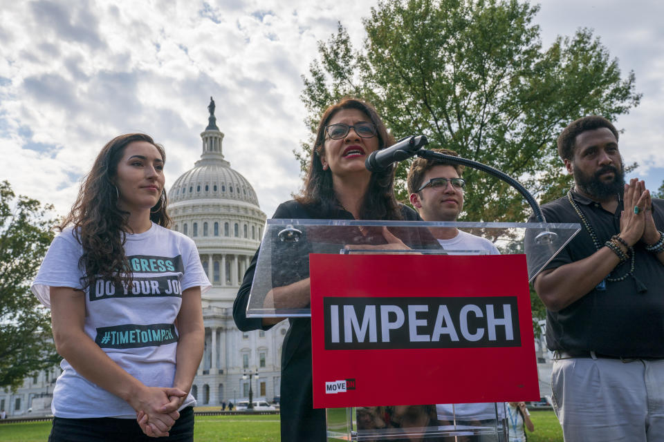 Rep. Rashida Tlaib, D-Mich., a member of the House Committee on Oversight and Reform, speaks as people rally for the impeachment of President Donald Trump, at the Capitol in Washington, Thursday, Sept. 26, 2019. Speaker of the House Nancy Pelosi, D-Calif., committed Tuesday to launching a formal impeachment inquiry against Trump. (AP Photo/J. Scott Applewhite)