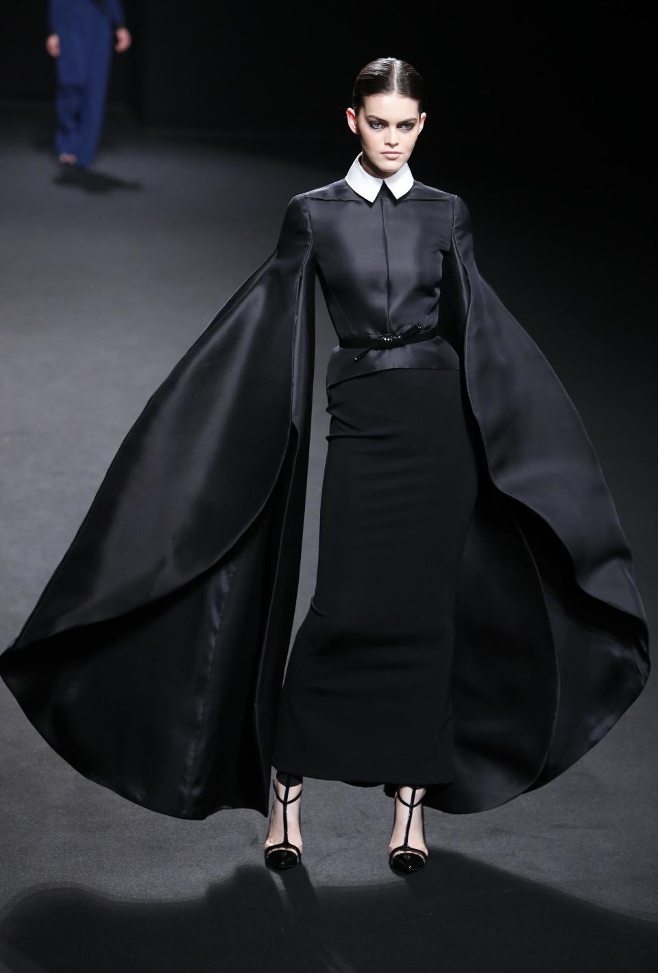 A model wears a creation by French fashion Stephane Rolland's Haute Couture Fall-Winter 2013-2014 collection presented Tuesday, July 2, 2013 in Paris. (AP Photo/Francois Mori)