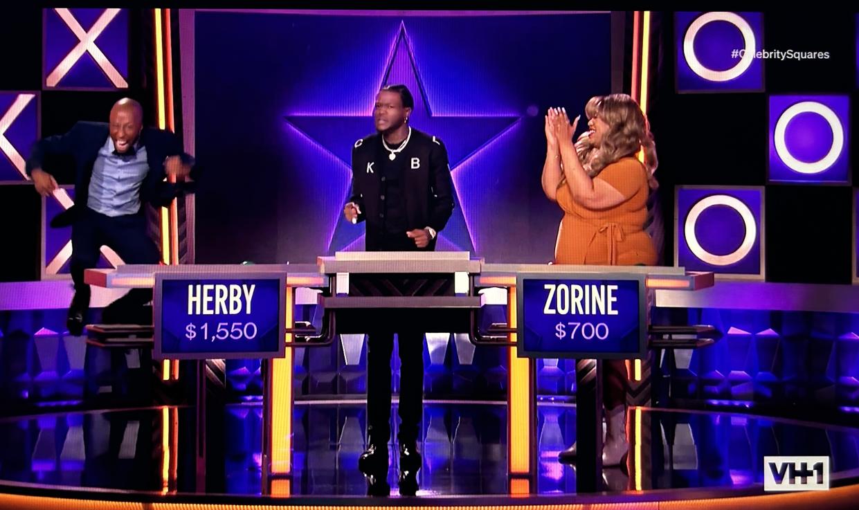 Contestant Herby gets airborne over his win on Celebrity Squares.